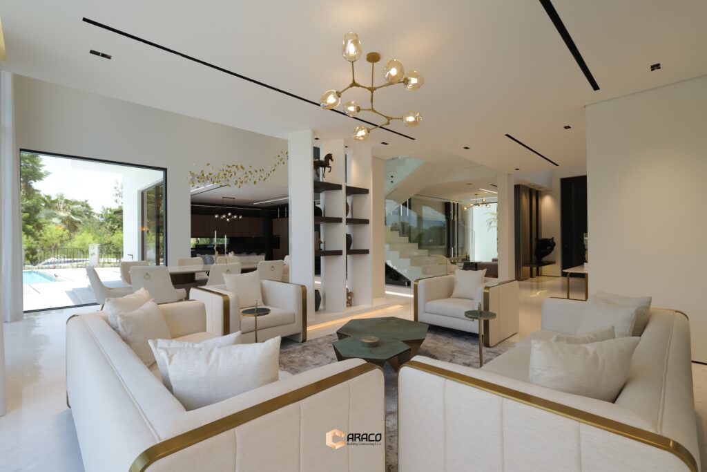 Elegant living room with modern furniture and natural lighting | Caraco Building Contracting