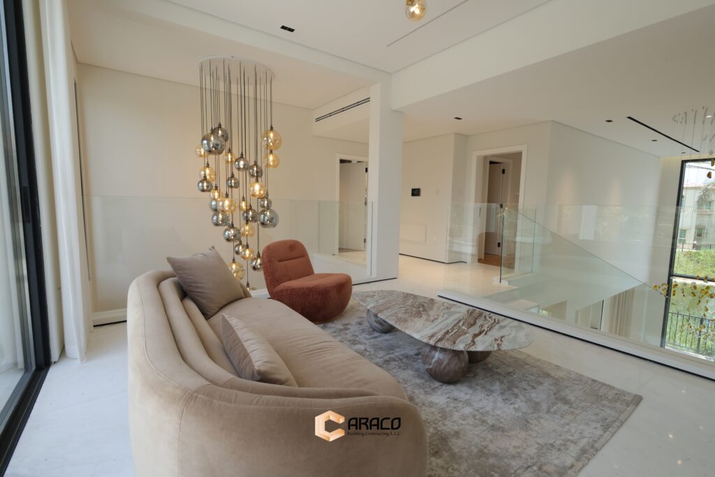 Elegant living room with modern furniture and natural lighting | Caraco Building Contracting