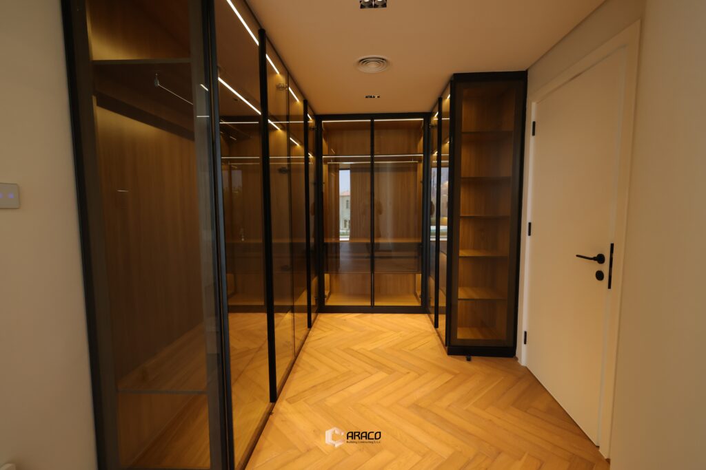 Spacious walk-in closet with organized shelves and modern design | Caraco Building Contracting