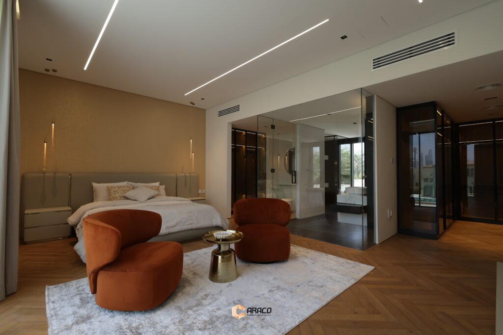 Spacious master bedroom with luxurious design and natural light | Caraco Building Contracting