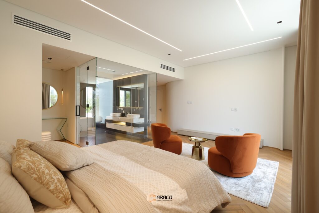 Spacious master bedroom with luxurious design and natural light | Caraco Building Contracting