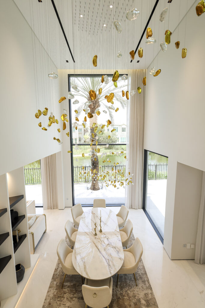 Elegant dining room with modern table and stylish chairs | Caraco Building Contracting